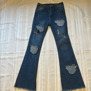 Blue Distressed Flare Jeans with Raw Hem